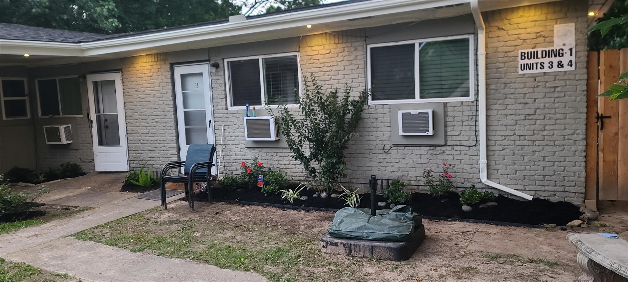 791 Fortune Street, Unit 4 Houston, TX 77088 - Photo 1 of 8 a view of a house with a yard and sitting area