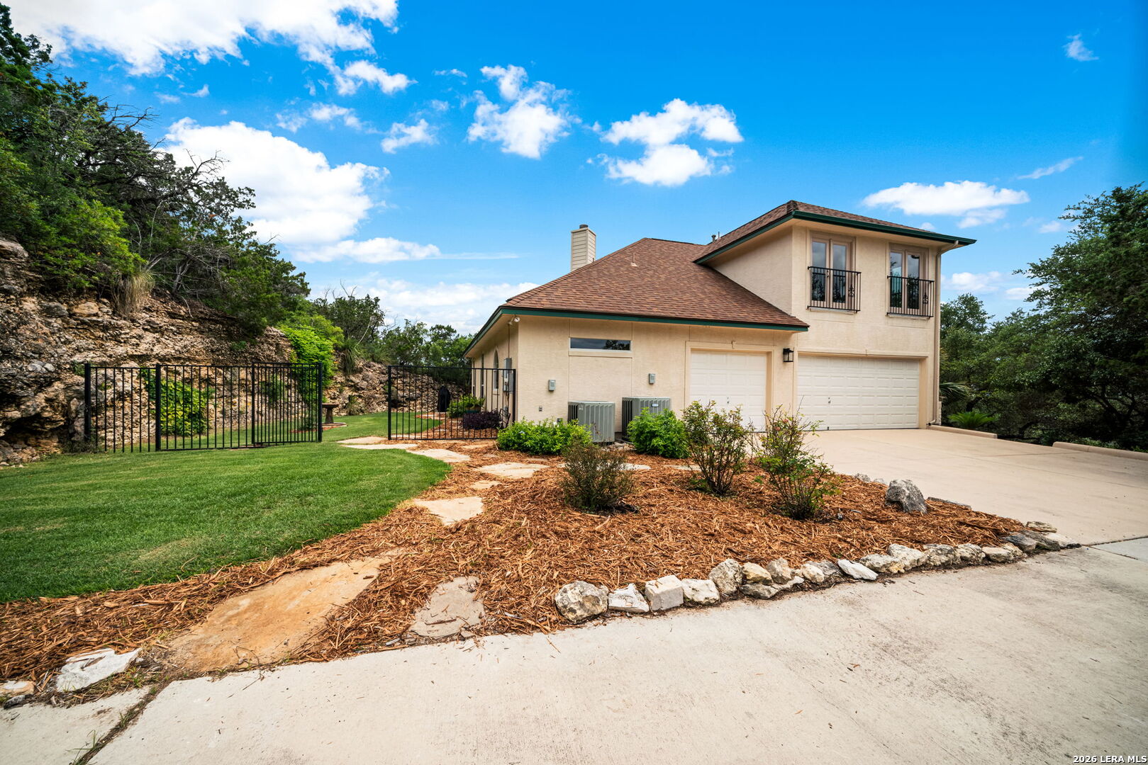 17431 Helotes Spring Road Helotes, TX 78023 - Photo 5 of 50 a front view of a house with garden