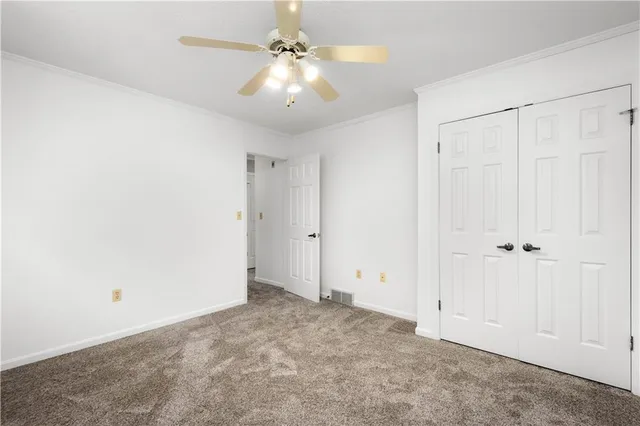 an empty room with fan