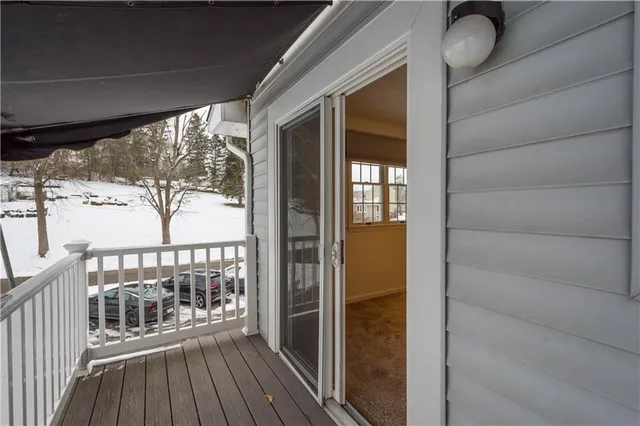 a view of a balcony with wooden floor