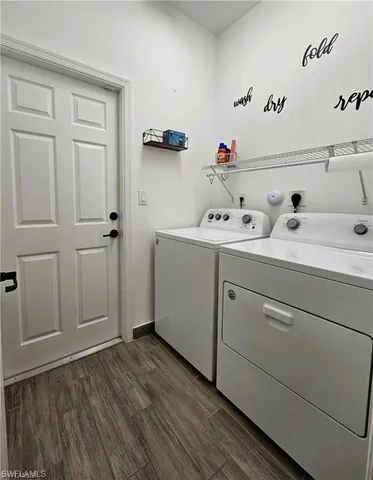 a view of storage and utility room with washer and dryer