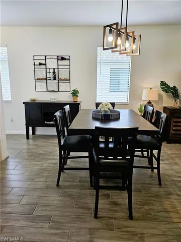 a view of a dining room with furniture wooden floor and breakfast area