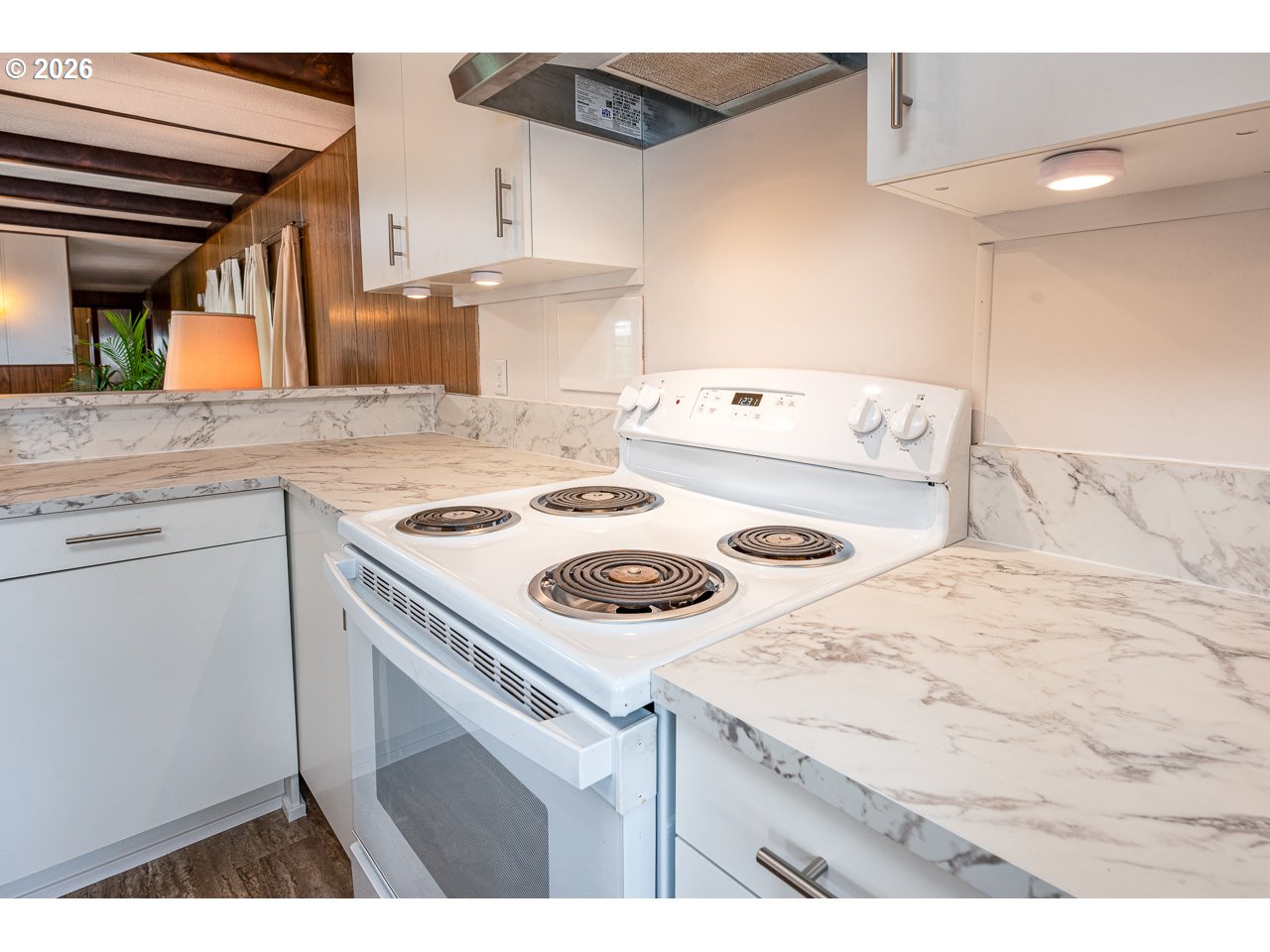 1475 Green Acres Road, Unit 172 Eugene, OR 97408 - Photo 14 of 20 a kitchen with a stove a sink and a refrigerator