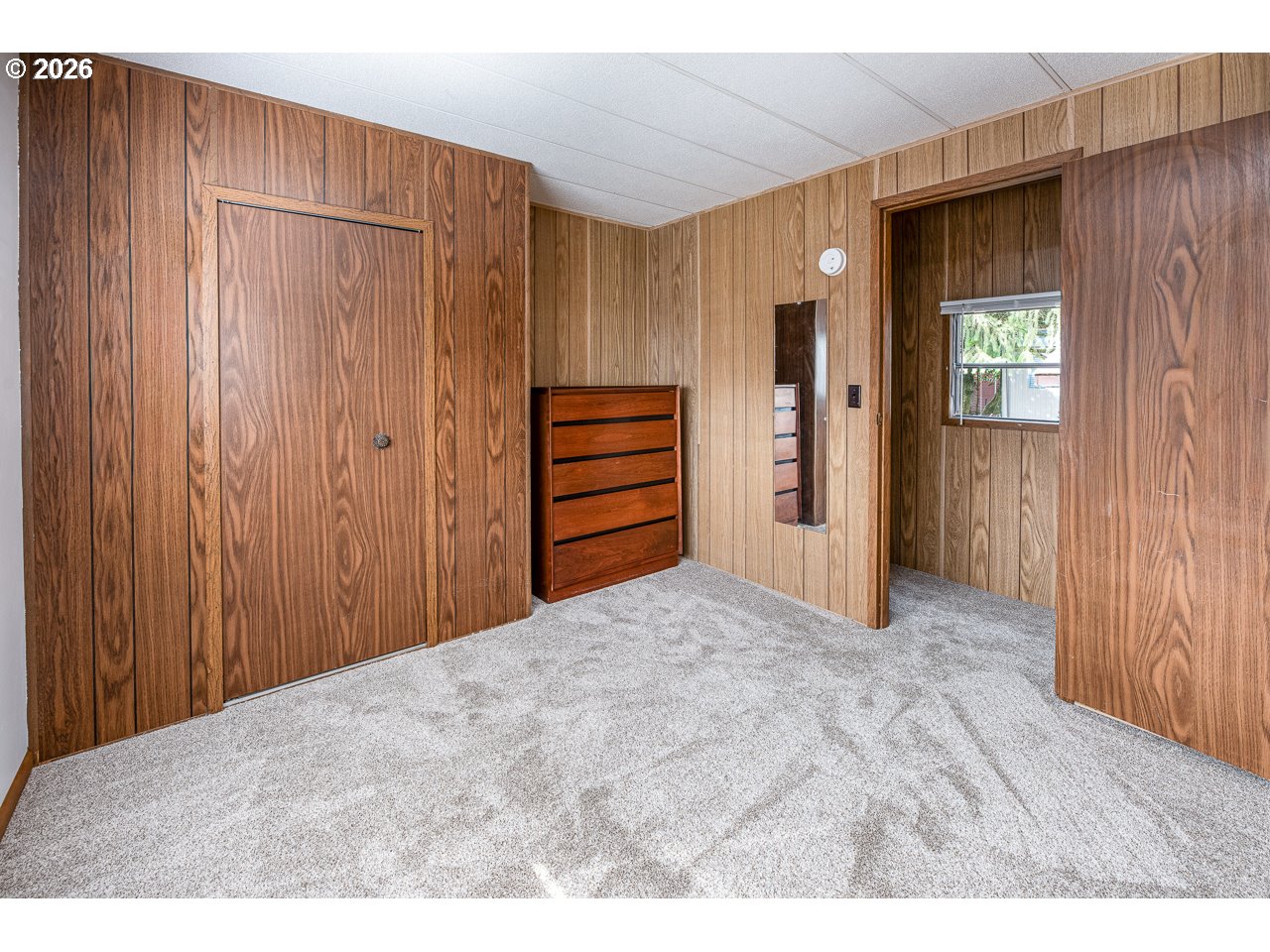 1475 Green Acres Road, Unit 172 Eugene, OR 97408 - Photo 17 of 20 a view of a closet area with hardwood
