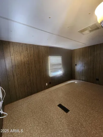 a view of an empty room and a window