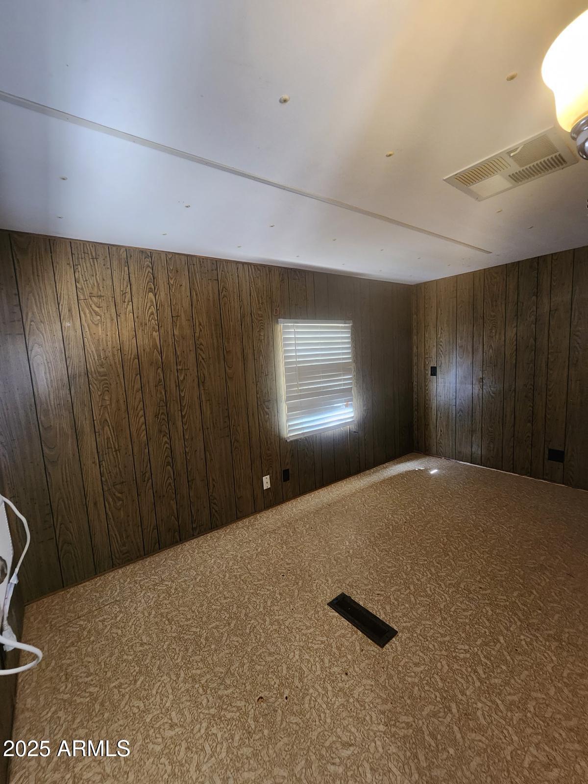 671 South Ellsworth Road, Unit A Mesa, AZ 85208 - Photo 7 of 8 a view of an empty room and a window