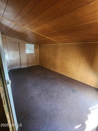 a view of a room with wooden floor and staircase