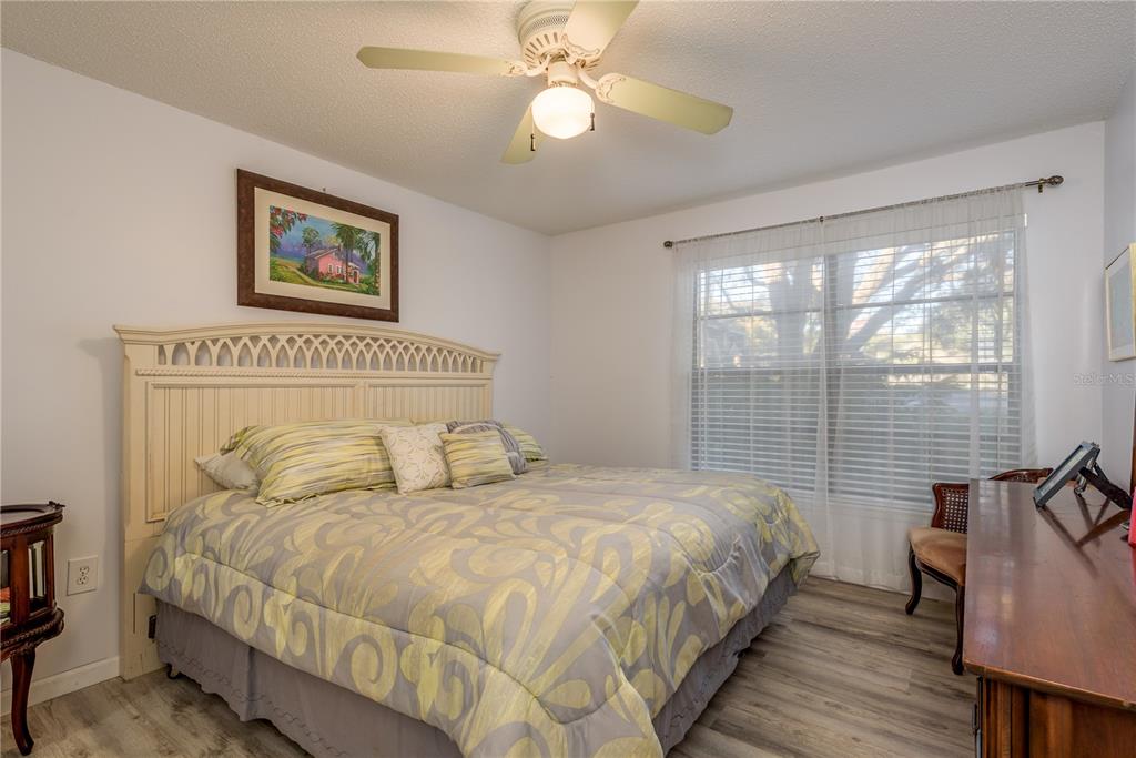 1901 Lennox Road East, Unit 1901 Palm Harbor, FL 34683 - Photo 11 of 25 a bed sitting in a bedroom next to a window