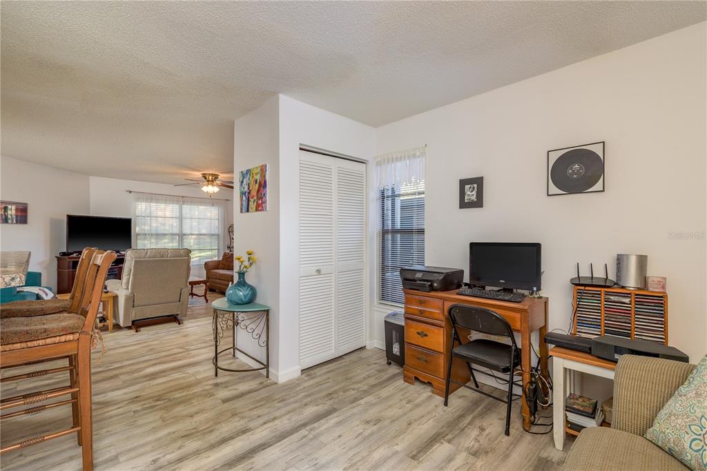 1901 Lennox Road East, Unit 1901 Palm Harbor, FL 34683 - Photo 17 of 25 a view of a livingroom with furniture and a flat screen tv