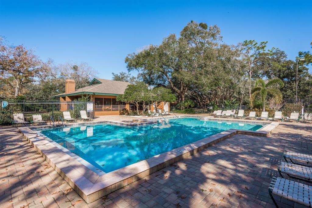 1901 Lennox Road East, Unit 1901 Palm Harbor, FL 34683 - Photo 23 of 25 a view of a house with backyard and sitting area