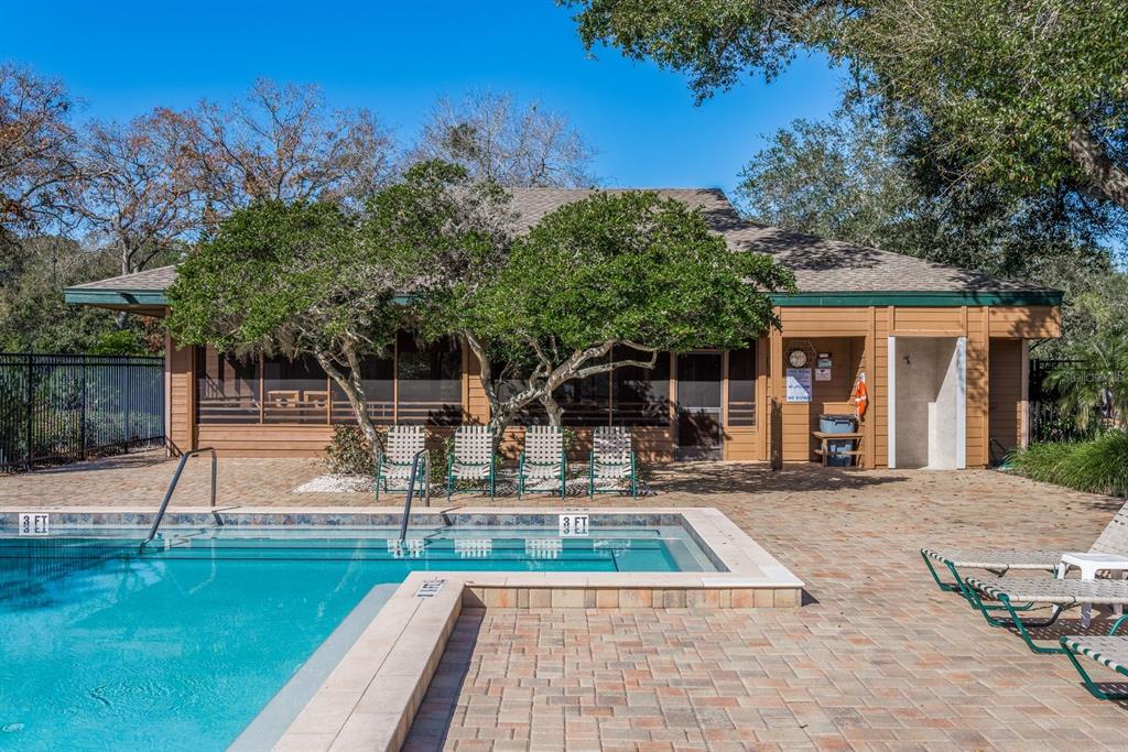 1901 Lennox Road East, Unit 1901 Palm Harbor, FL 34683 - Photo 24 of 25 a view of a house with backyard and sitting area