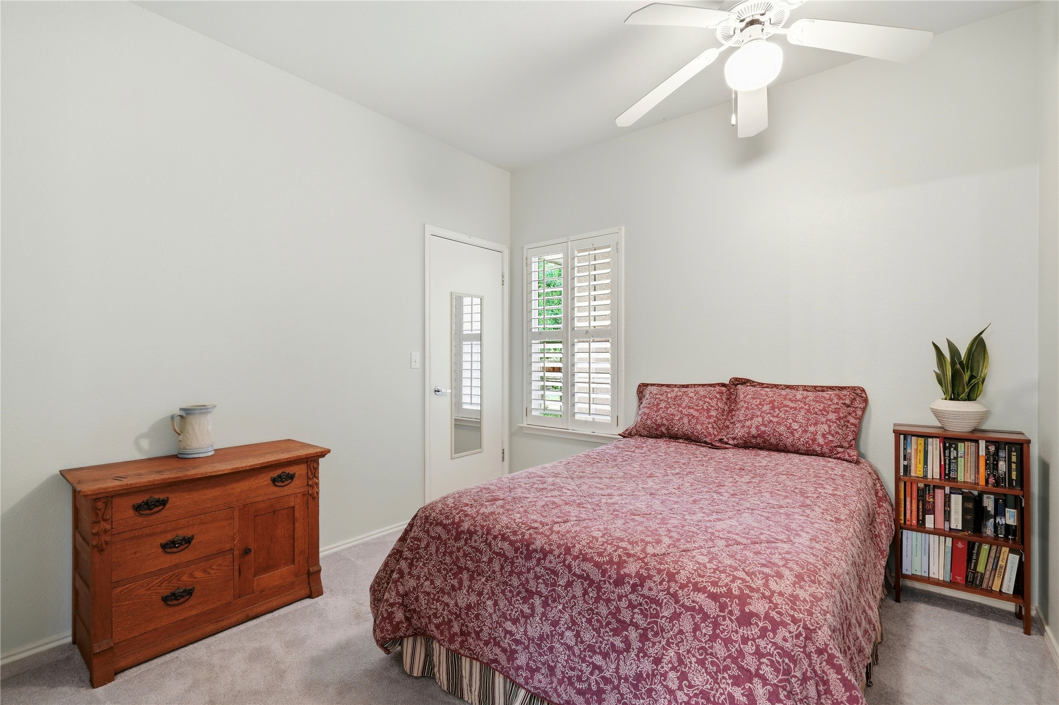 117 Whitewing Way Georgetown, TX 78633 - Photo 17 of 27 The secondary bedrooms offers carpeted floors and excellent natural light through the window with plantation shutters. This room makes the perfect guest room
