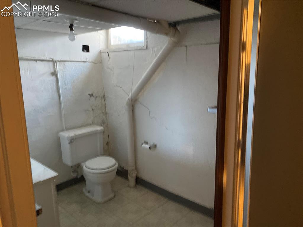 2150 Glenn Street Colorado Springs, CO 80904 - Photo 13 of 30 a bathroom with a toilet and a shower