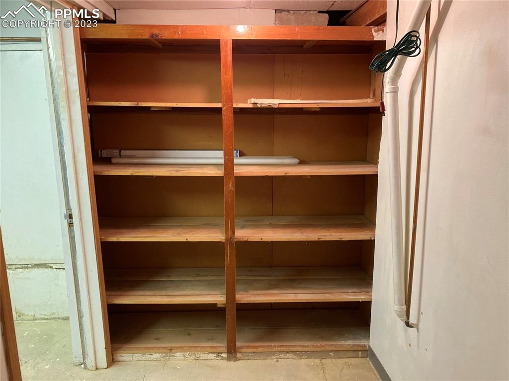 2150 Glenn Street Colorado Springs, CO 80904 - Photo 15 of 30 a view of walk in closet with empty racks