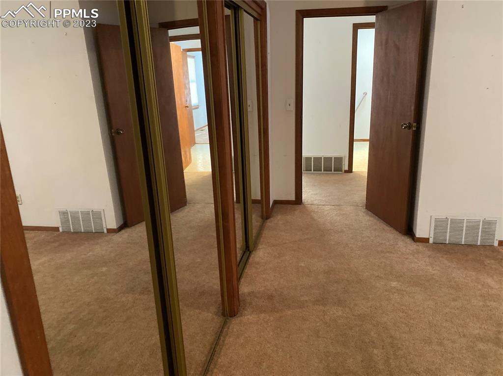 2150 Glenn Street Colorado Springs, CO 80904 - Photo 27 of 30 a view of a hallway to rooms