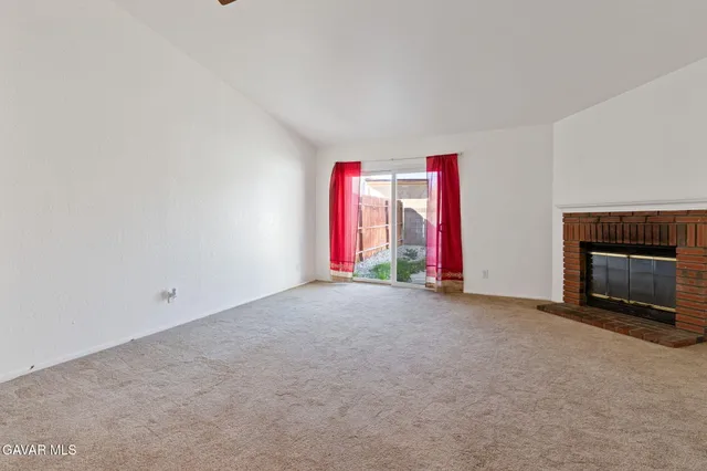 an empty room with an empty space and window