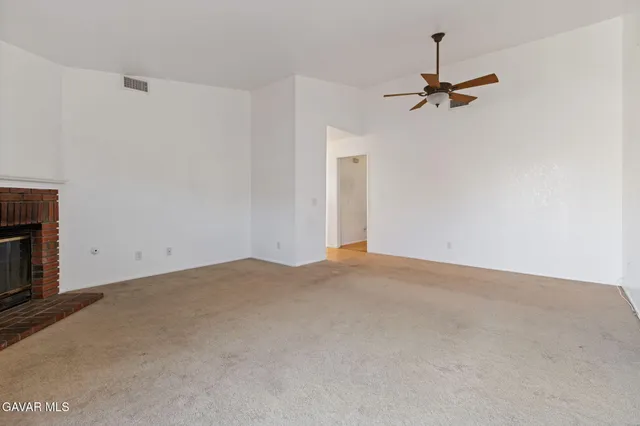 a view of empty room with windows