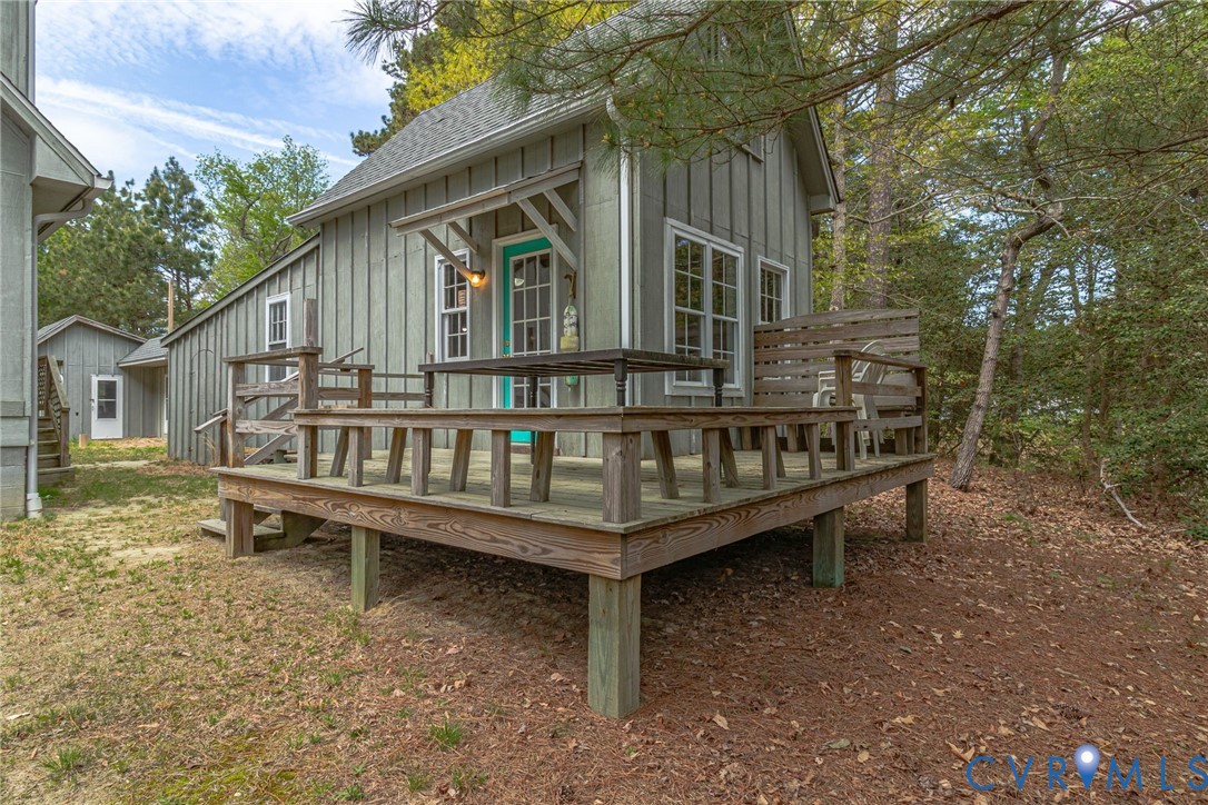 193 Deep Water Lane Reedville, VA 22539 - Photo 69 of 84 a view of a wooden deck with a yard and wooden fence