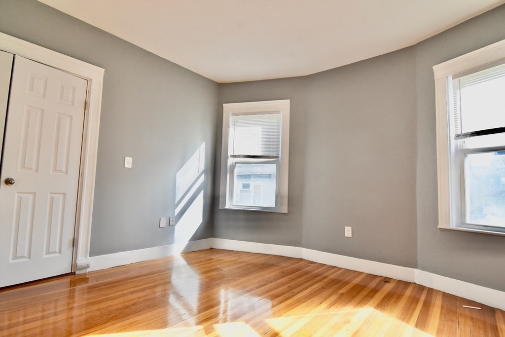 21 Treadway Road, Unit 2 Boston, MA 02125 - Photo 13 of 21 a view of empty room with wooden floor and fan
