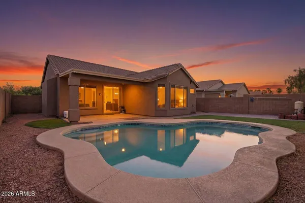 a view of a swimming pool with a lounge chairs