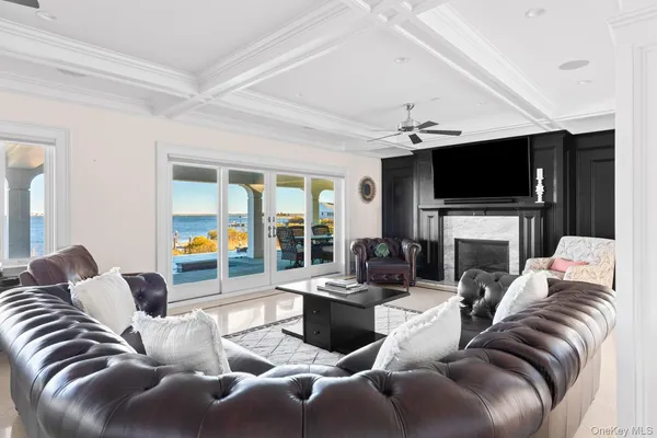 a living room with furniture rug and window