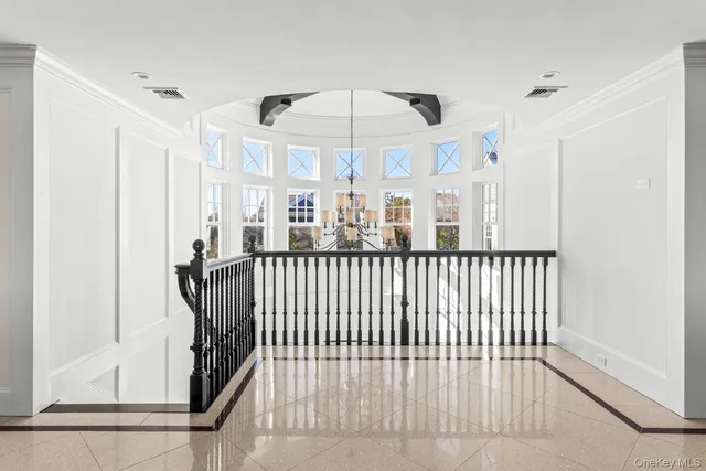 a living room with furniture fireplace and flat screen tv