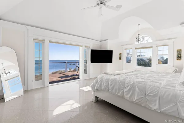 a spacious bathroom with a mirror sink and shower