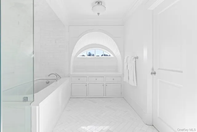 a bathroom with a toilet a sink a mirror a vanity and a shower