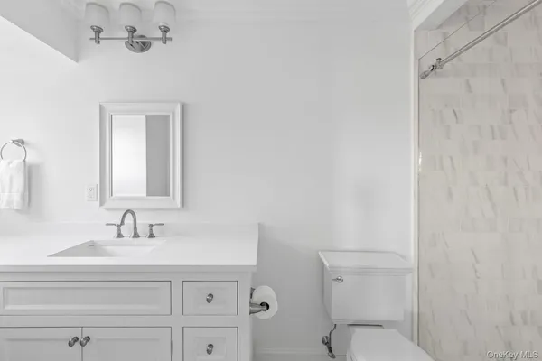 a utility room with sink dryer and washer