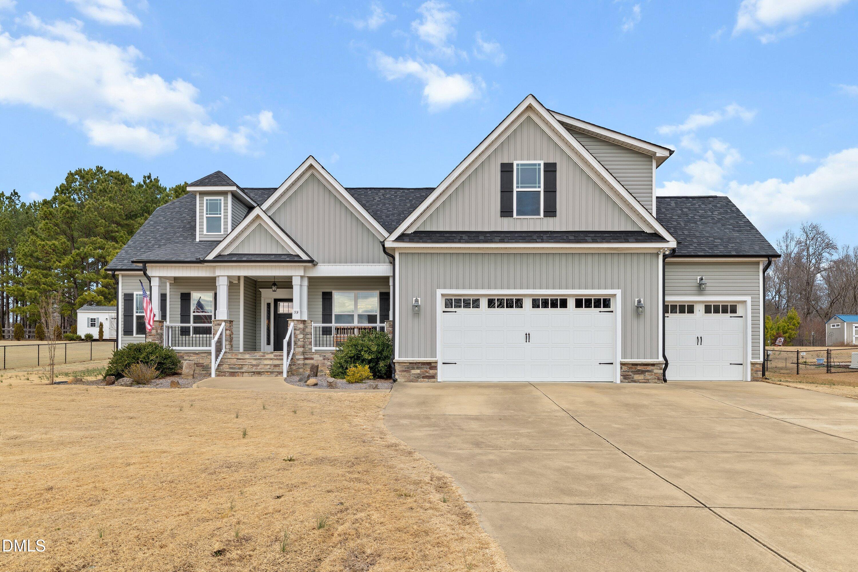 59 Coats Ridge Drive Benson, NC 27504 - Photo 1 of 44 a front view of a house with a yard