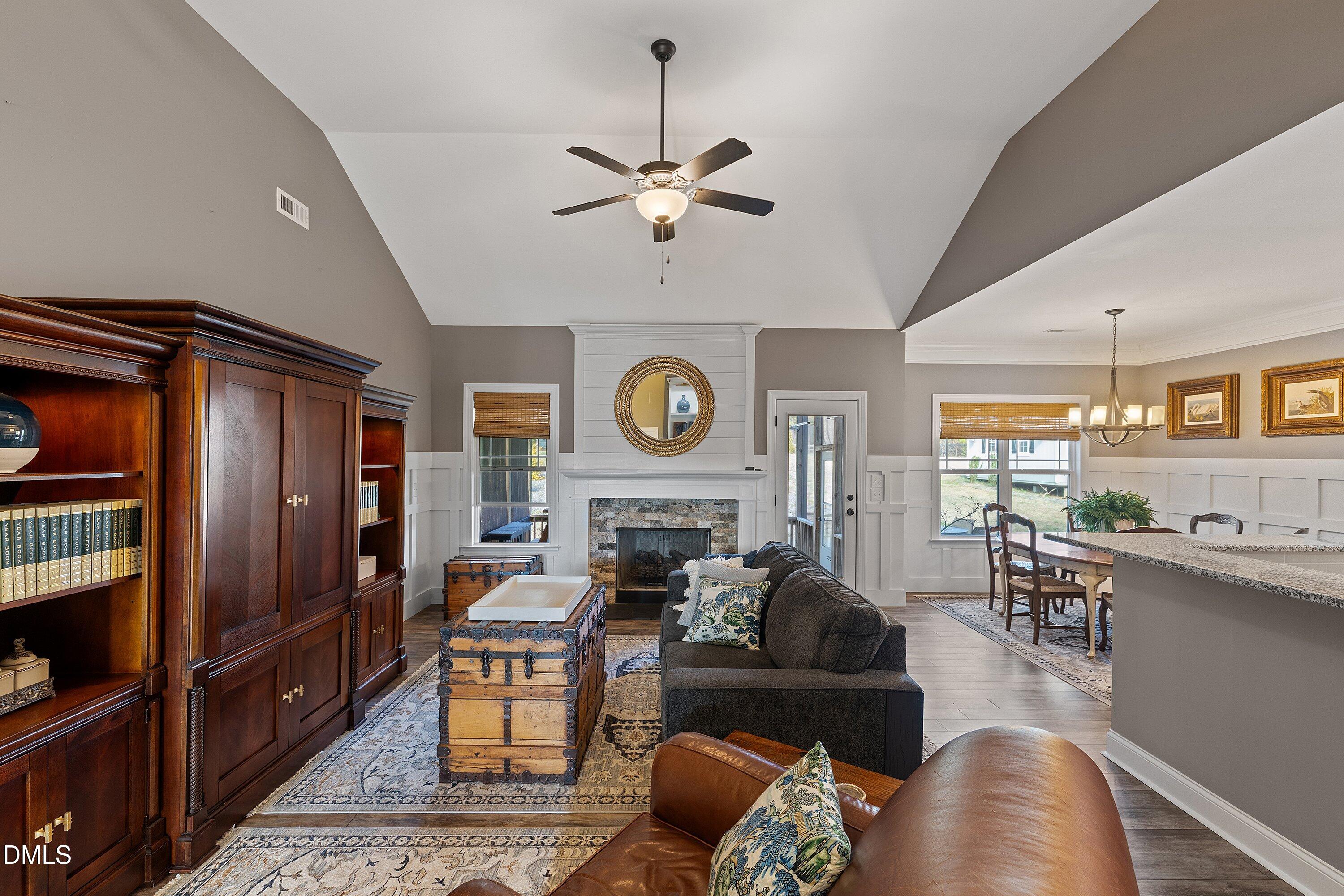 59 Coats Ridge Drive Benson, NC 27504 - Photo 14 of 44 a living room with furniture a fireplace and kitchen view