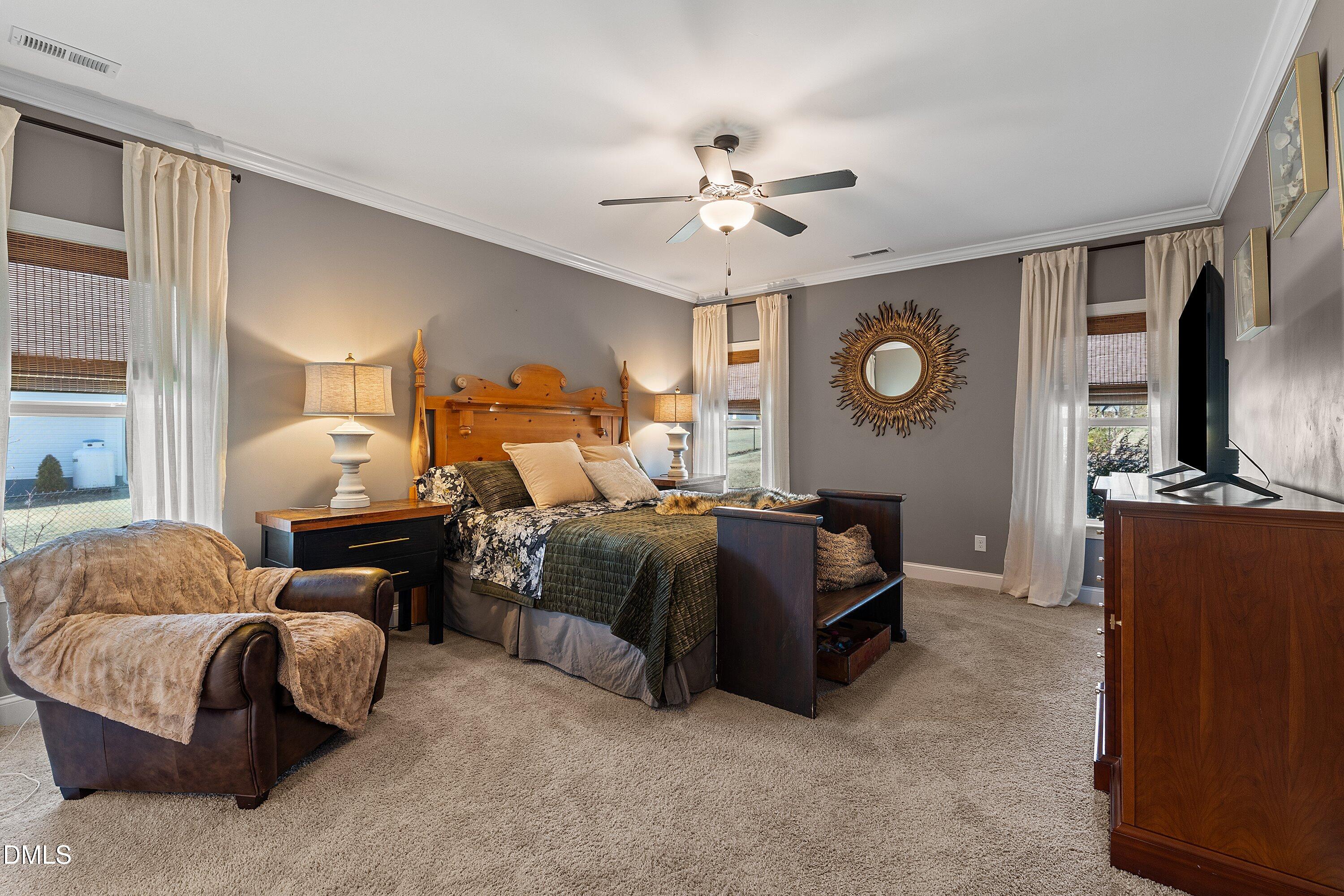 59 Coats Ridge Drive Benson, NC 27504 - Photo 15 of 44 a spacious bedroom with a bed and window