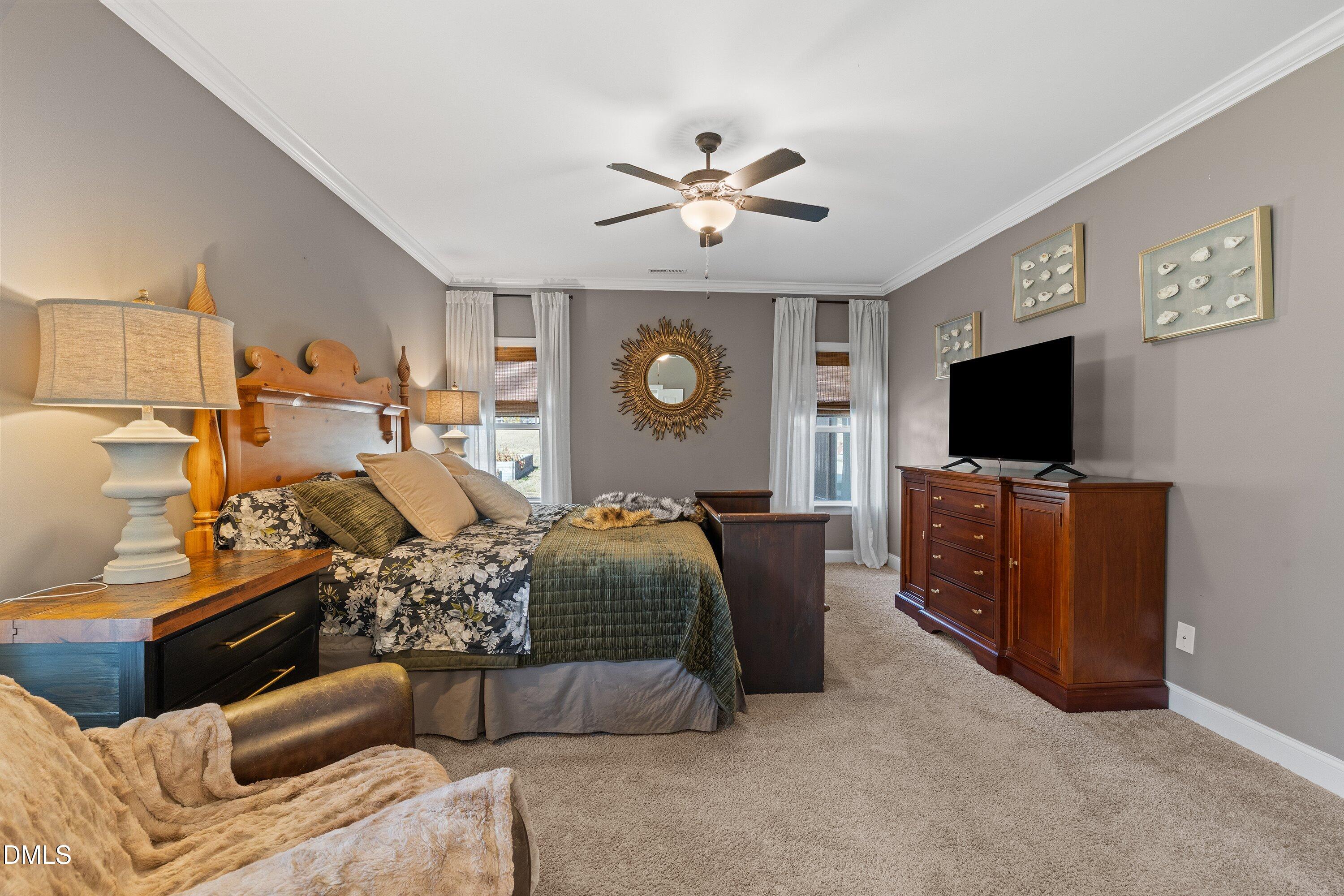 59 Coats Ridge Drive Benson, NC 27504 - Photo 16 of 44 a living room with furniture and a flat screen tv