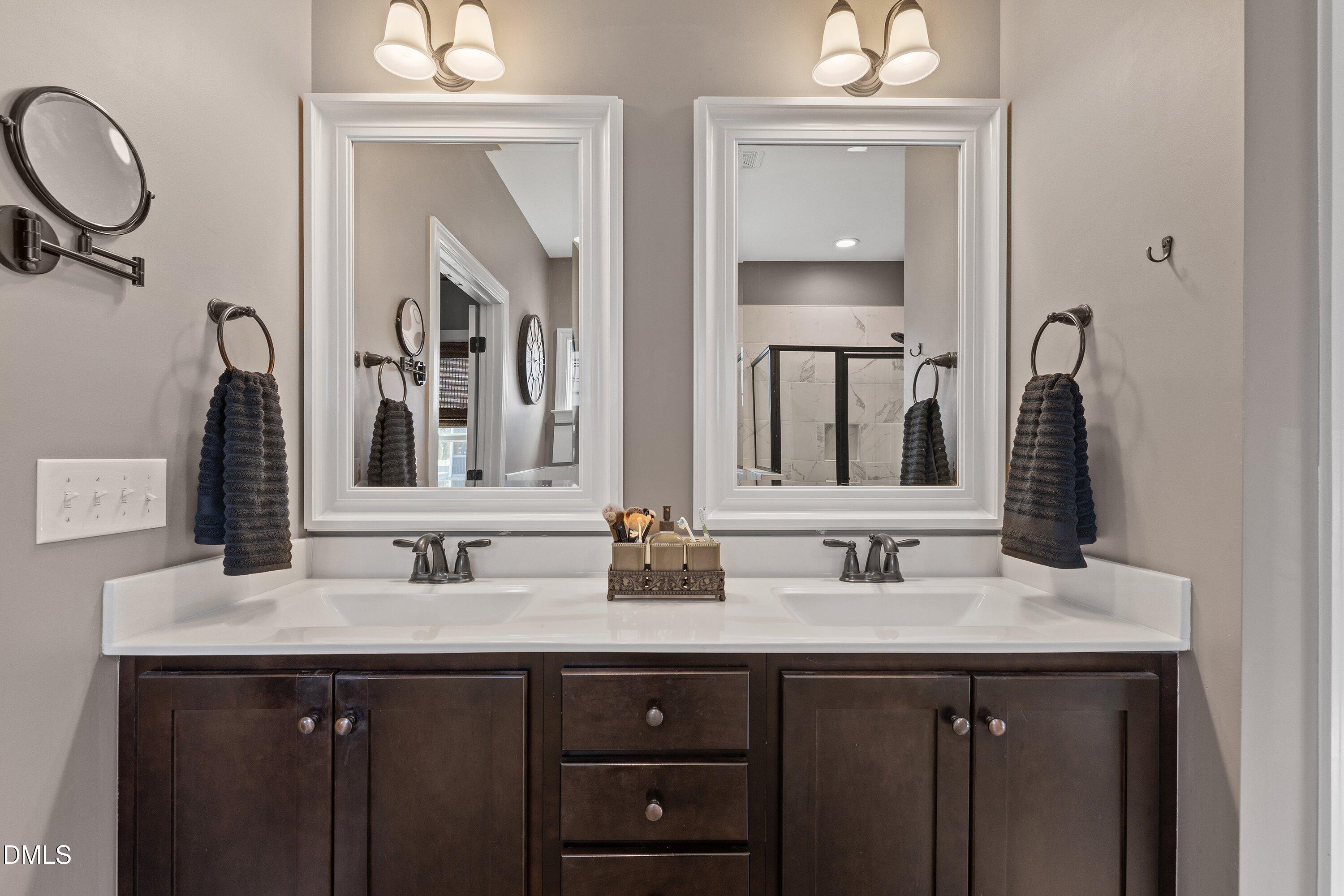 59 Coats Ridge Drive Benson, NC 27504 - Photo 20 of 44 a bathroom with 2 sink and a mirror