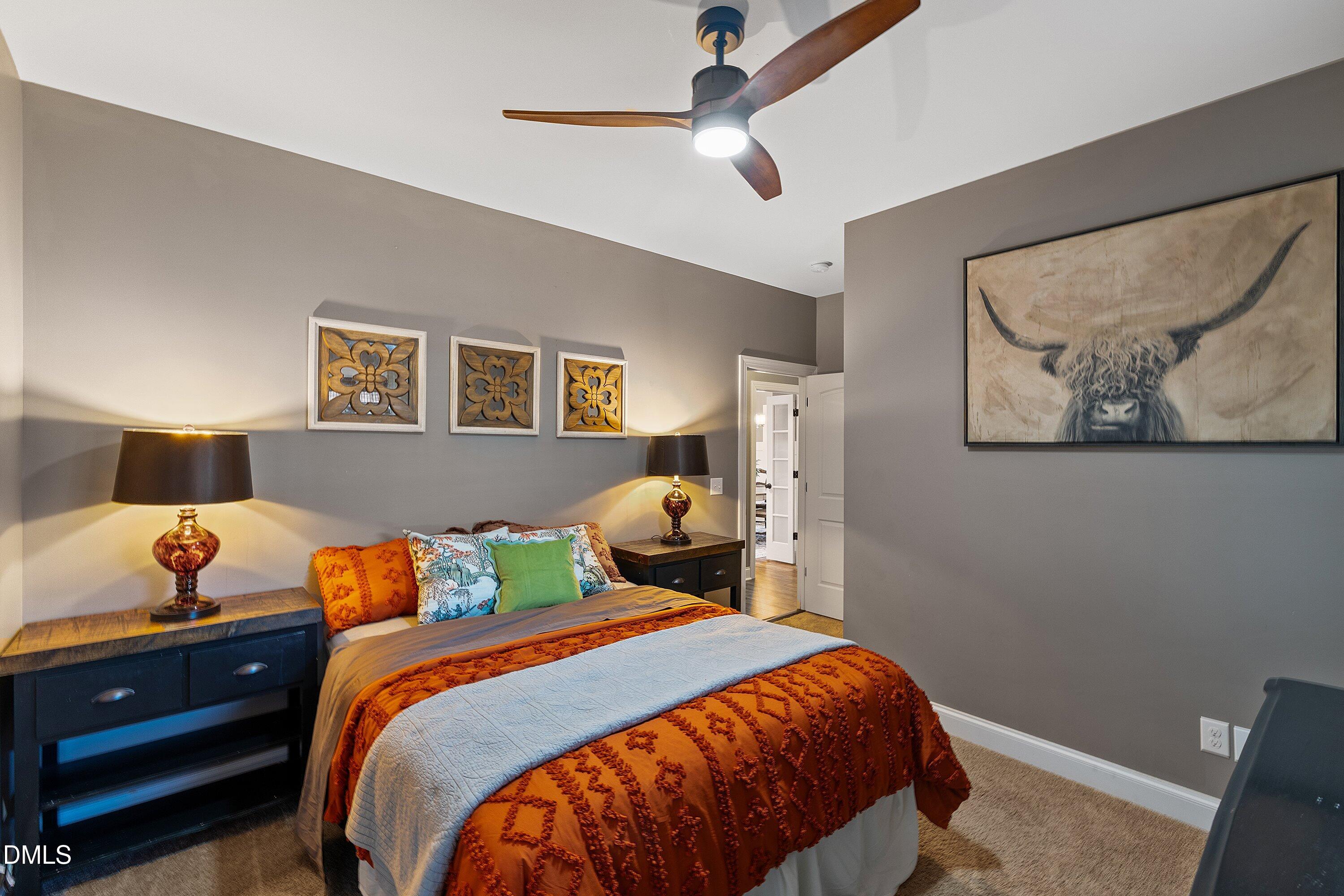59 Coats Ridge Drive Benson, NC 27504 - Photo 25 of 44 a bedroom with a bed and wooden floor