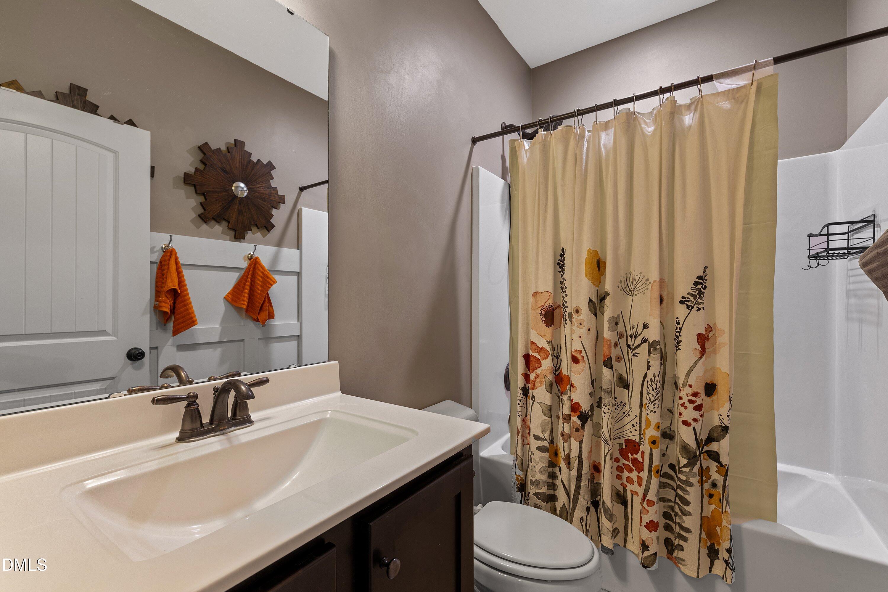 59 Coats Ridge Drive Benson, NC 27504 - Photo 26 of 44 a bathroom with a sink toilet and shower