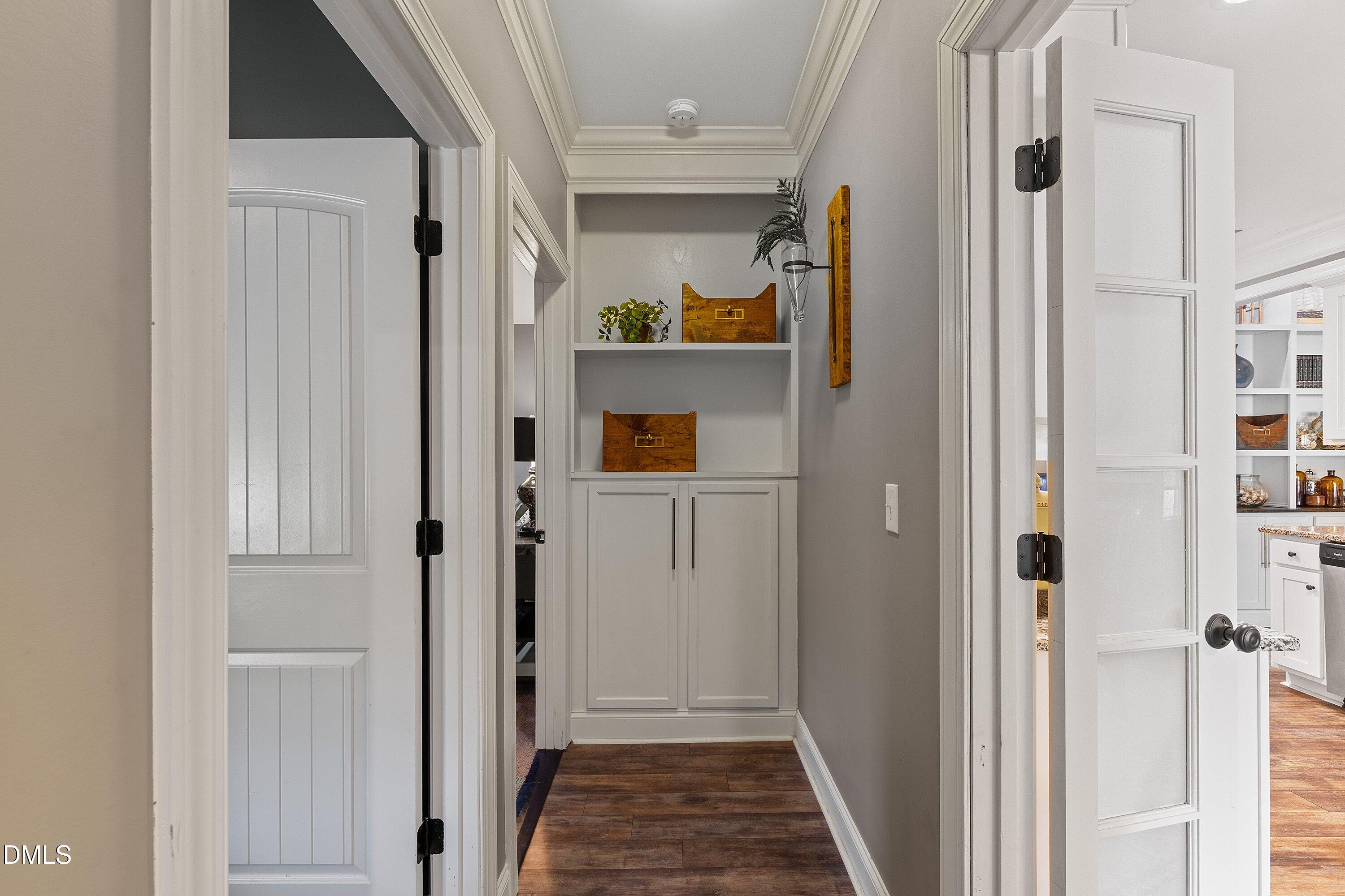 59 Coats Ridge Drive Benson, NC 27504 - Photo 27 of 44 a view of a hallway with wooden shelves