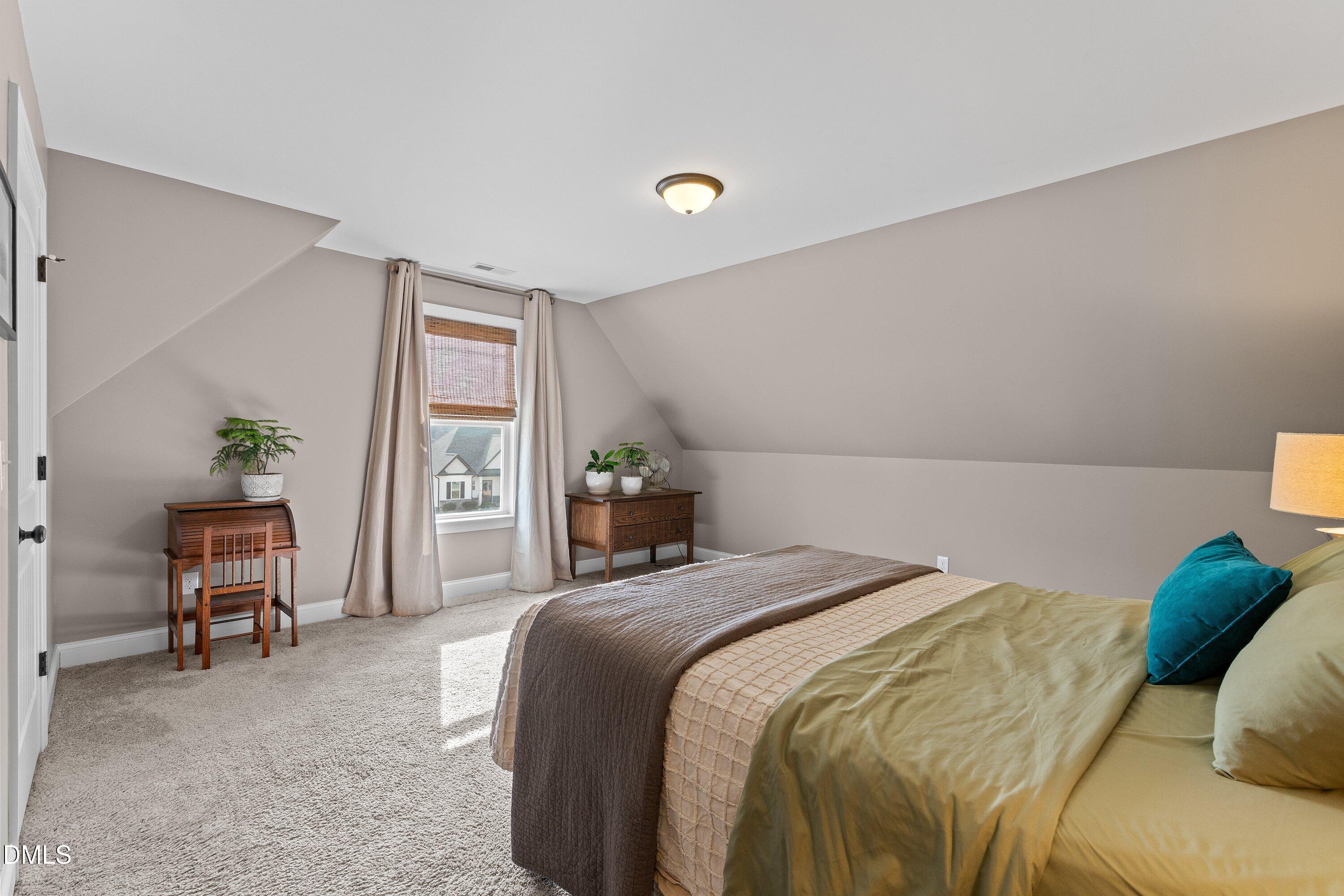 59 Coats Ridge Drive Benson, NC 27504 - Photo 30 of 44 a bedroom with a bed and a desk