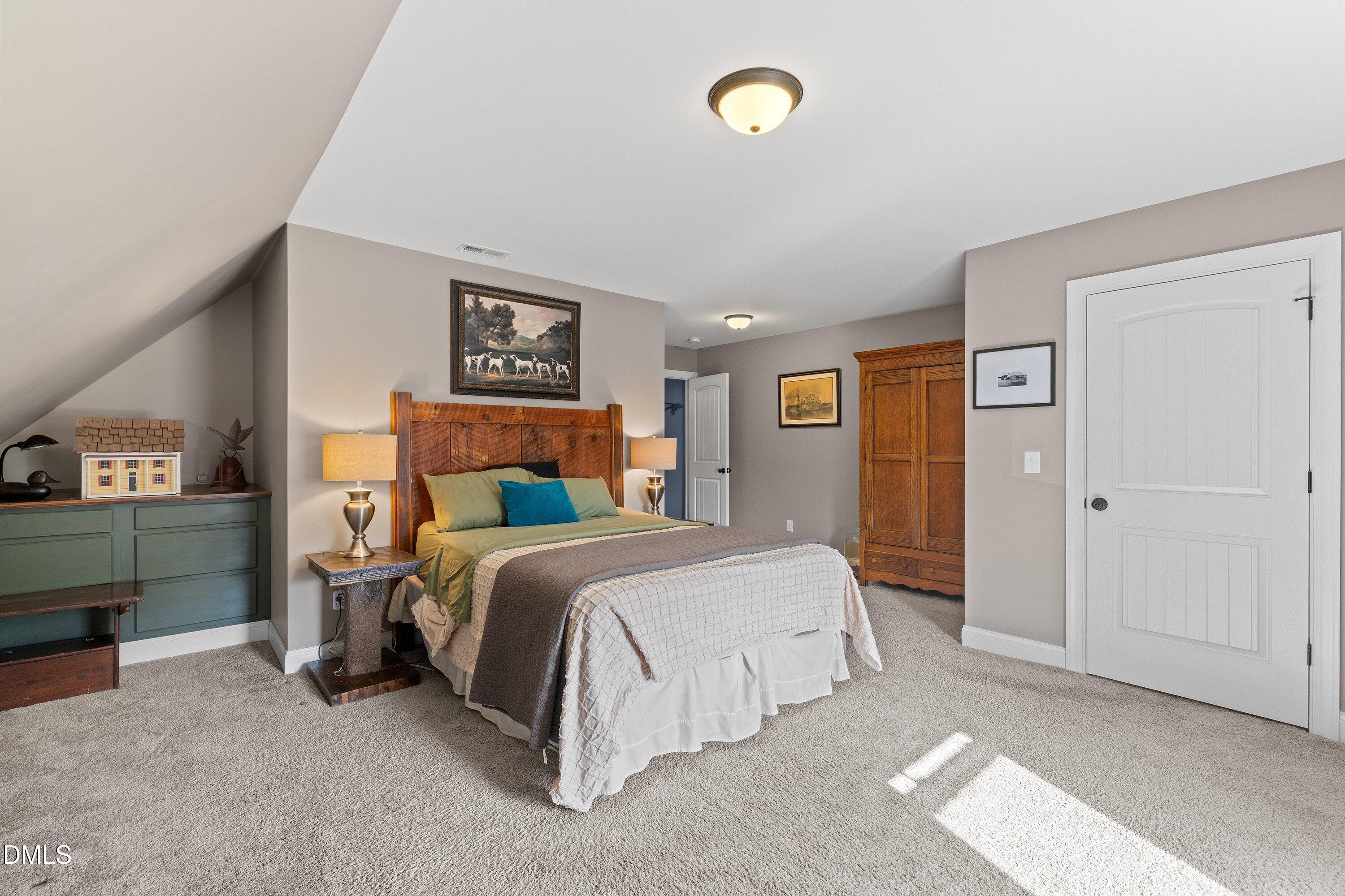 59 Coats Ridge Drive Benson, NC 27504 - Photo 31 of 44 a bedroom with a bed and a cabinets