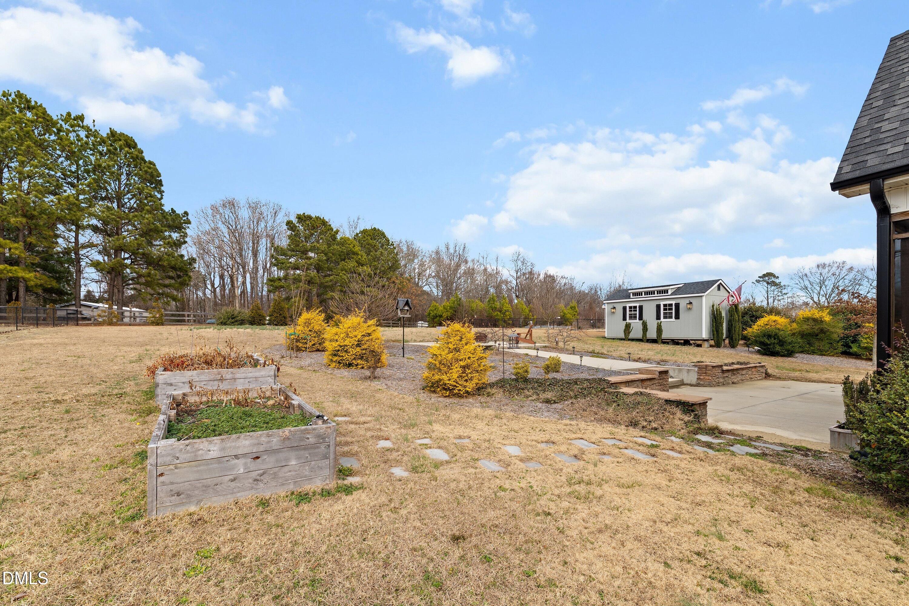 59 Coats Ridge Drive Benson, NC 27504 - Photo 33 of 44 a view of a yard with furniture and a fire pit