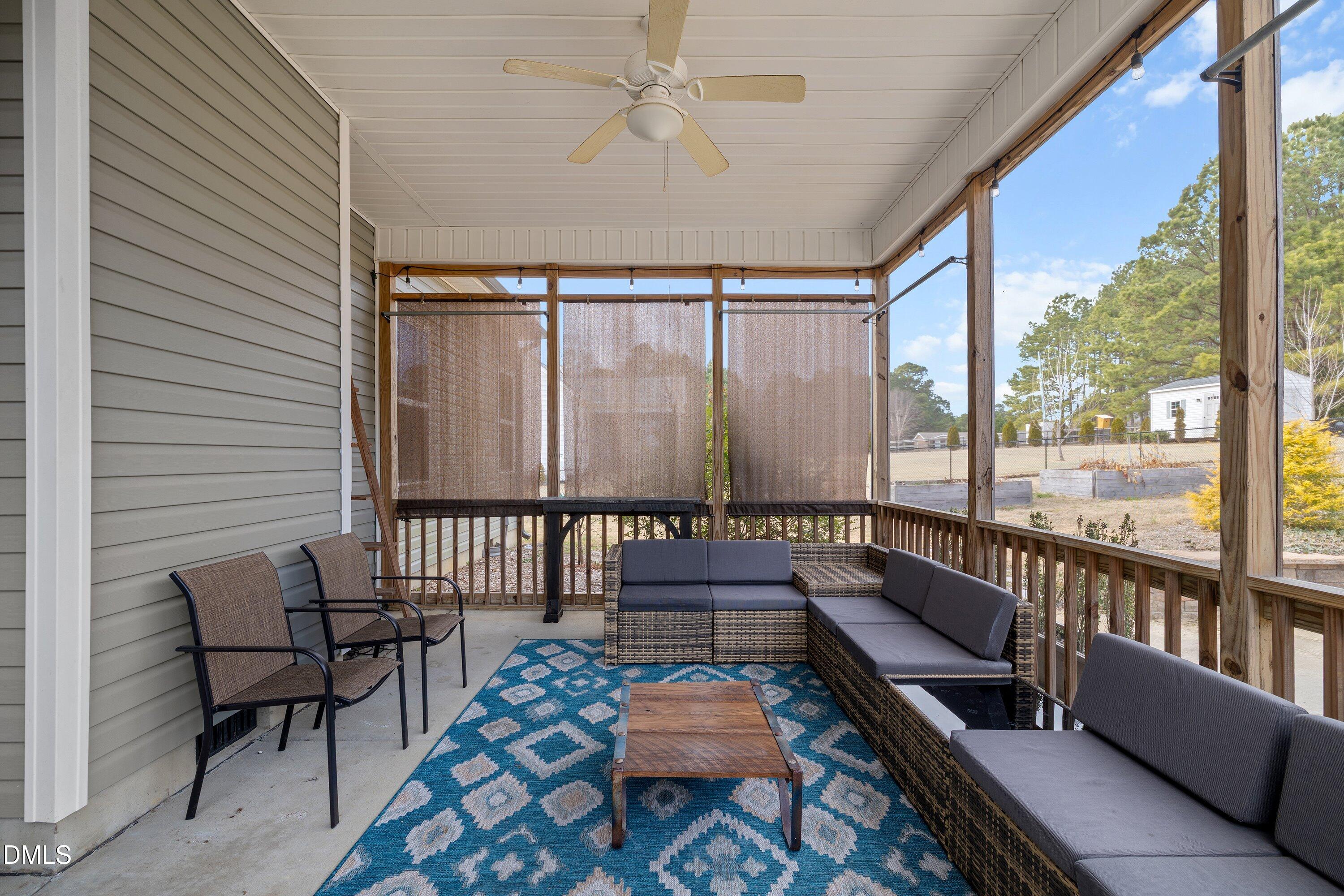 59 Coats Ridge Drive Benson, NC 27504 - Photo 35 of 44 a balcony with furniture and a potted plant