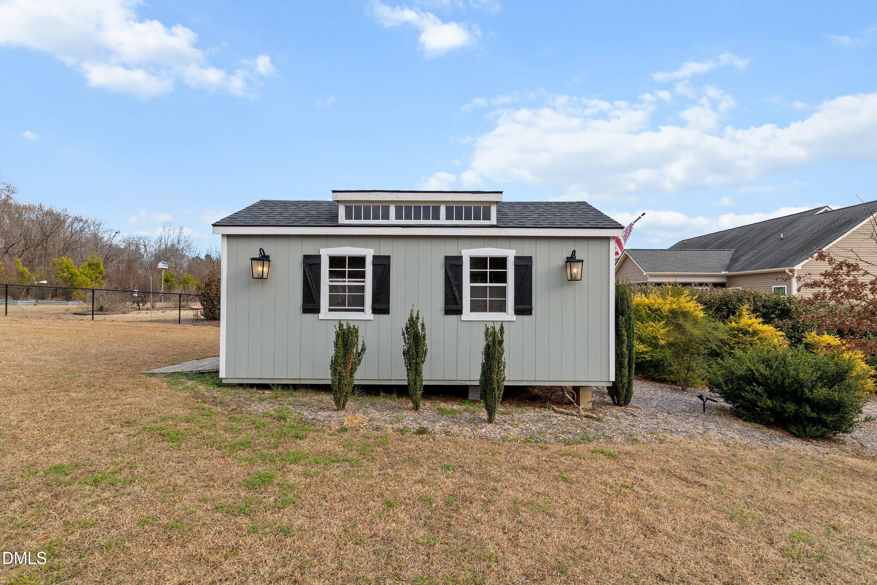59 Coats Ridge Drive Benson, NC 27504 - Photo 37 of 44 a front view of a house with a yard