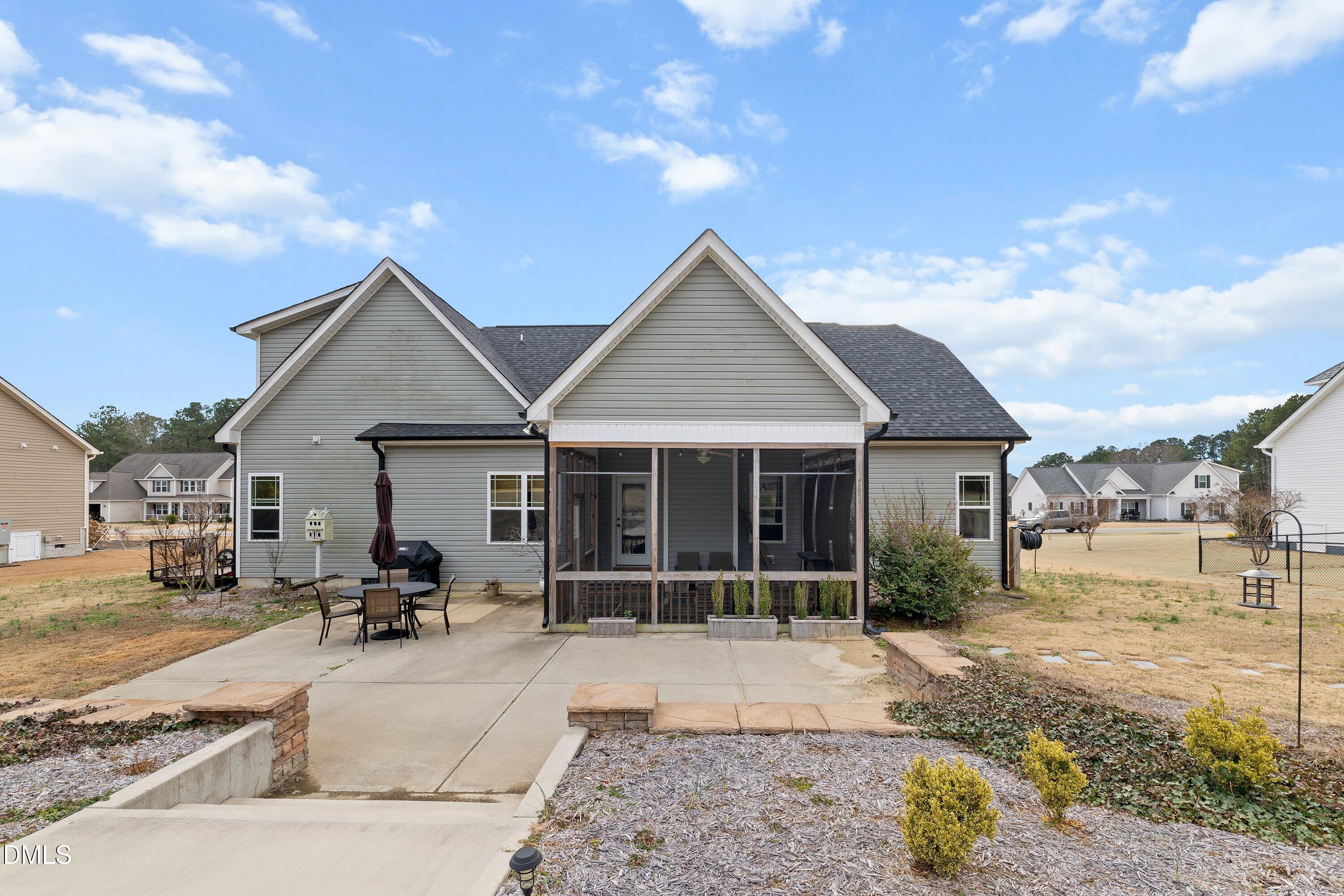 59 Coats Ridge Drive Benson, NC 27504 - Photo 39 of 44 a view of a house with a patio