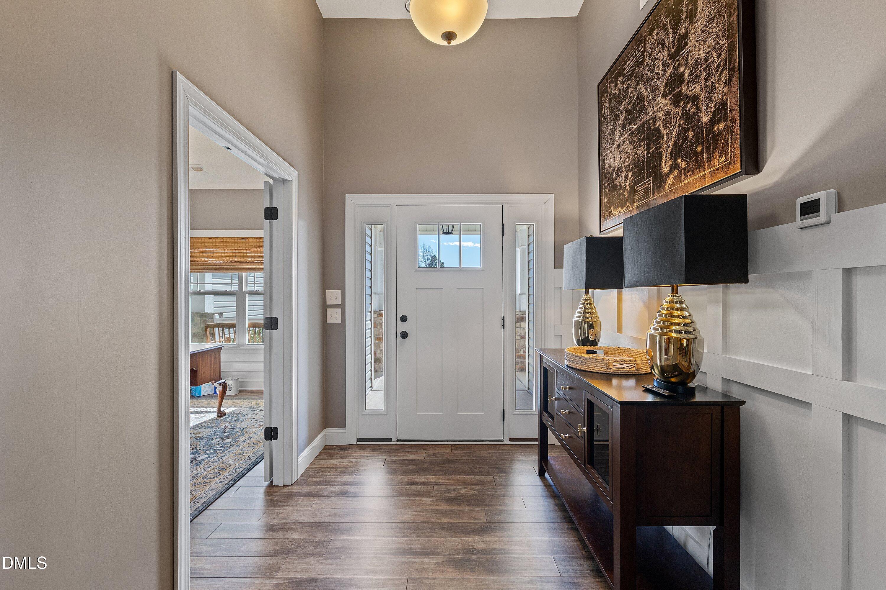59 Coats Ridge Drive Benson, NC 27504 - Photo 3 of 44 a view of workspace with wooden floor outdoor seating space and flat screen tv