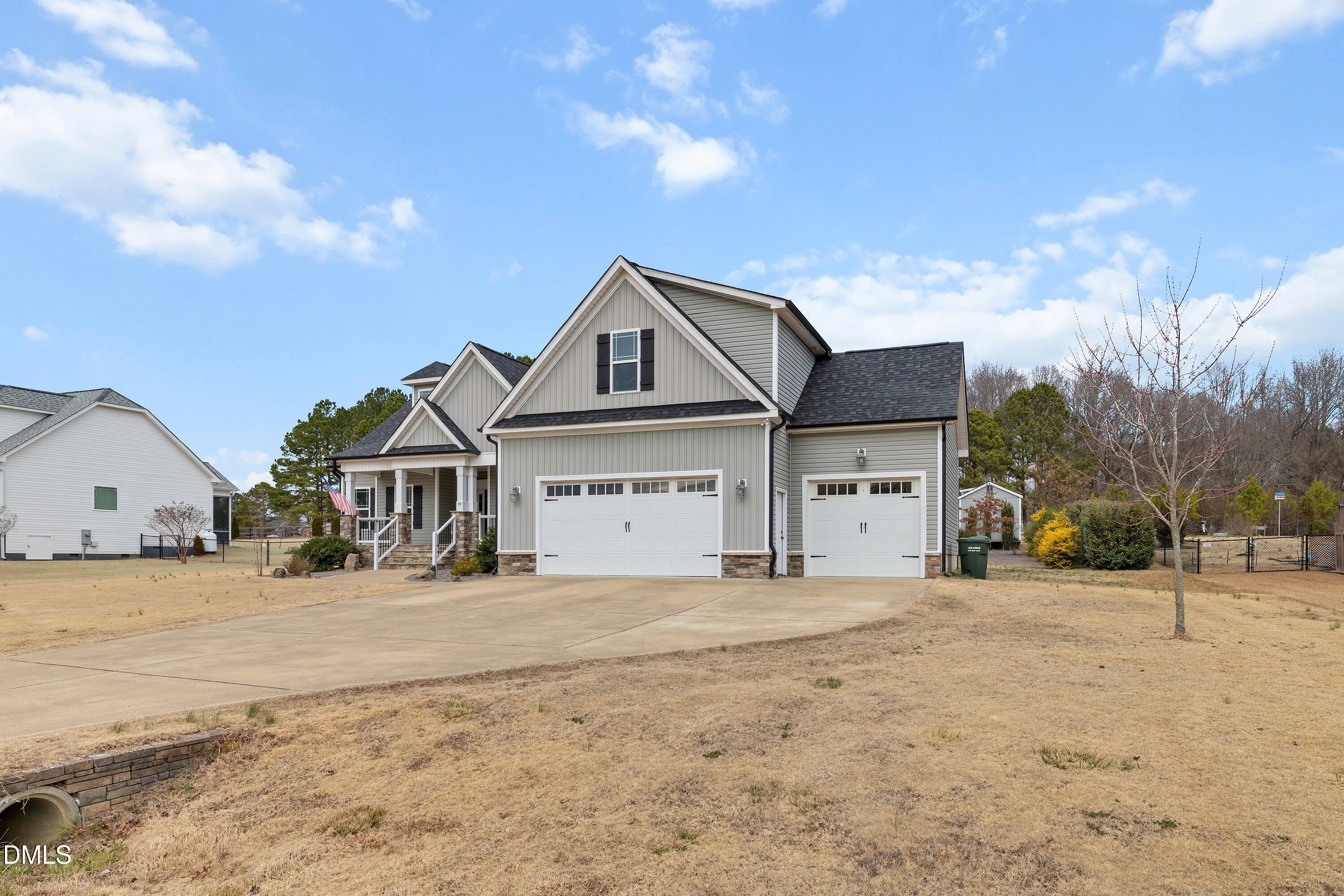59 Coats Ridge Drive Benson, NC 27504 - Photo 42 of 44 a front view of a house with a yard