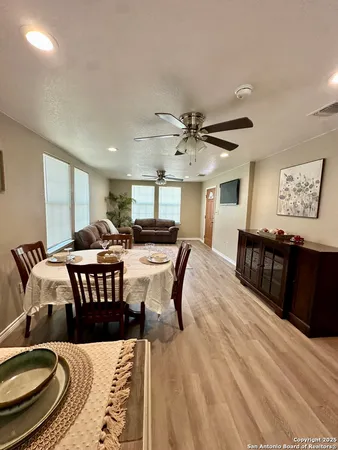 a living room with furniture and a rug