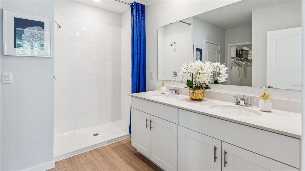 2408 Candlewick Street Deltona, FL 32738 - Photo 11 of 15 a bathroom with a sink and a mirror
