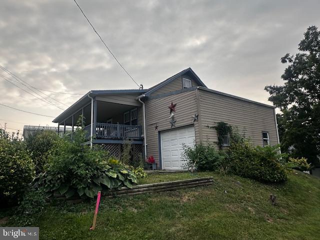 303 16th Street Saxton, PA 16678 - Photo 13 of 44 a front view of house with yard and green space
