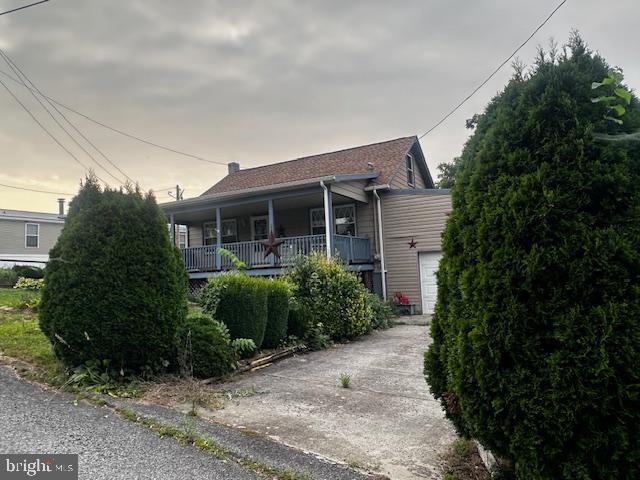 303 16th Street Saxton, PA 16678 - Photo 16 of 44 a view of a house with brick walls and a yard