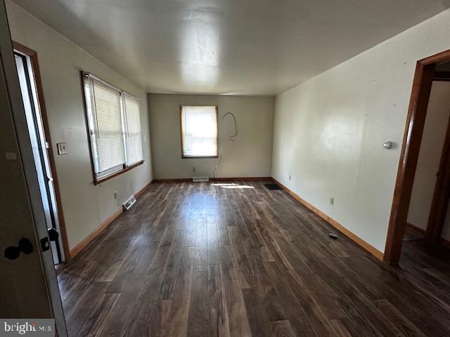 303 16th Street Saxton, PA 16678 - Photo 29 of 44 an empty room with wooden floor and windows